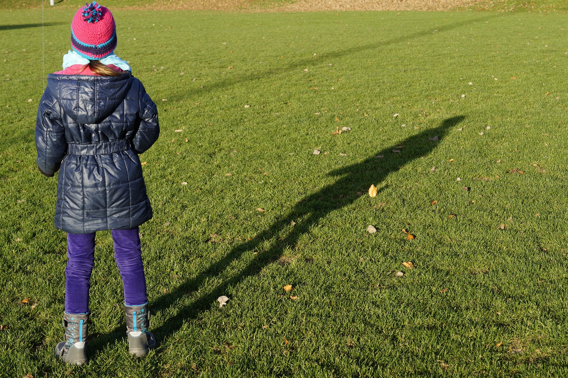 Young girl with long shadow