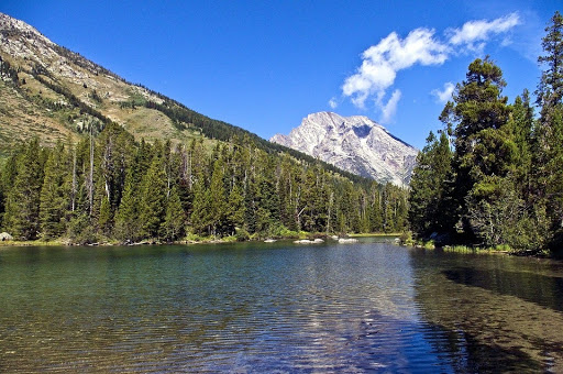 Mountains by water with no reflection